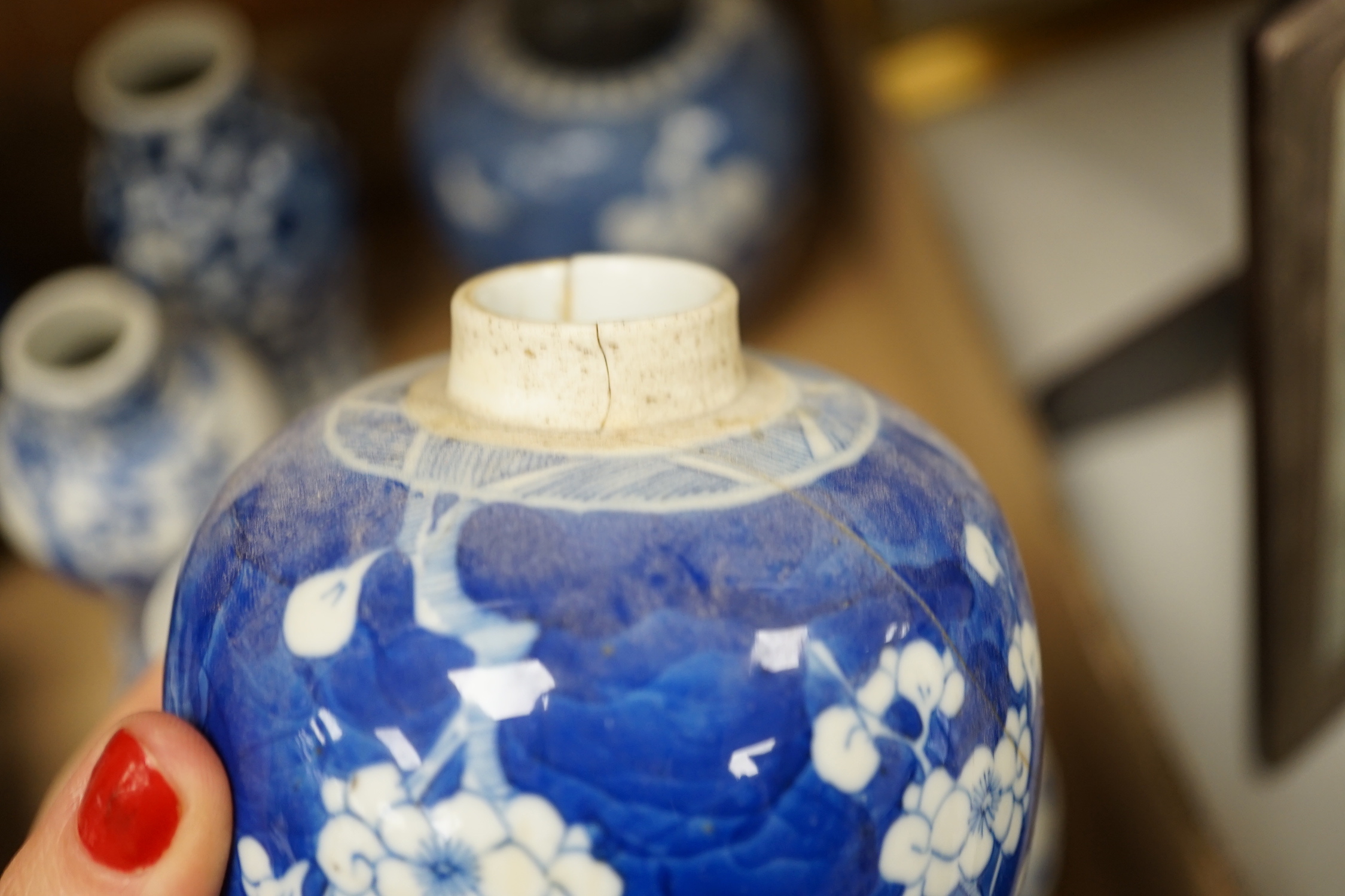 A collection of 18th - early 20th century Chinese blue and white porcelain vases, jars and spare covers, together with some Japanese blue and white ceramics, tallest 21cm